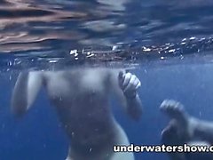 Three girls swimming nude in the sea